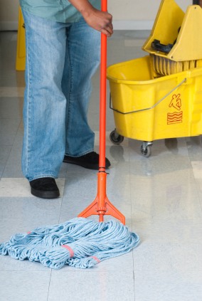 Cristow C Solutions LLC janitor in Pittsfield, MA mopping floor.